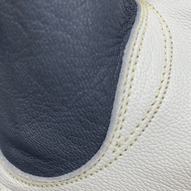 Close-up of premium goat skin leather welding gloves with Kevlar stitching and reinforced drag pad for TIG welding protection